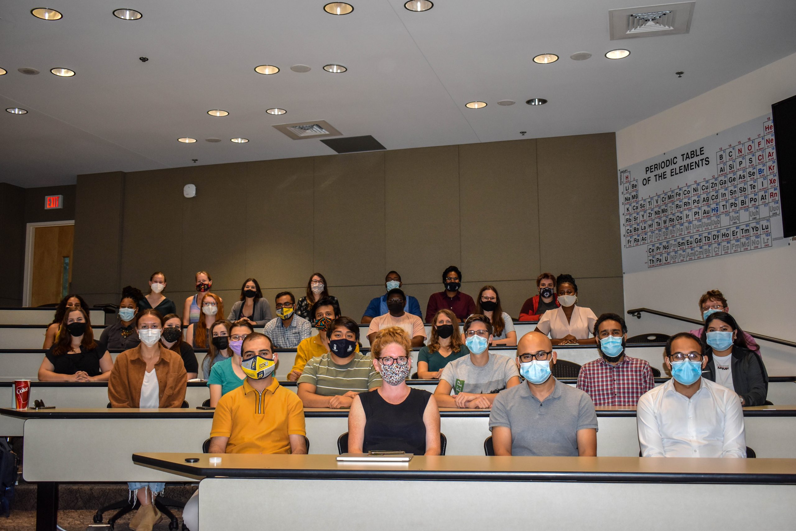 Graduate students sitting in classroom with masks on