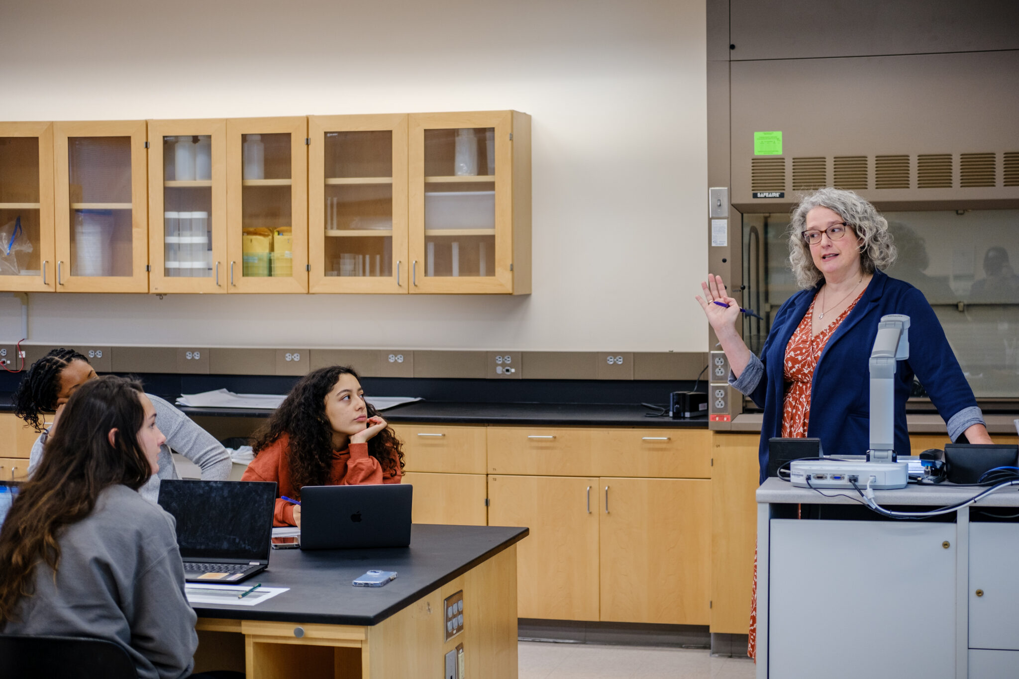 BIO instructor Heather Rushforth speaks to students in the lab classroom.